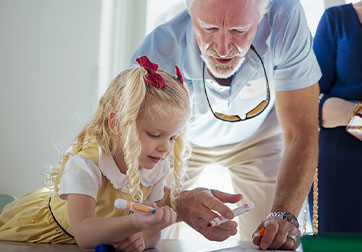 Photo of older gentleman and young girl. Links to Beneficiary Designations page.