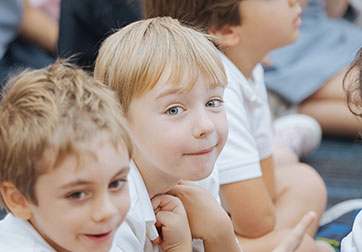 Photo of a smiling student. Links to Gifts of Real Estate page.