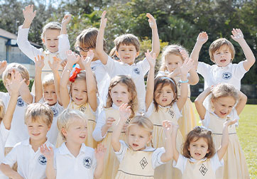 Photo of cheering children. Links to Gifts by Estate Note page.